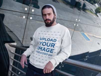 Man Wearing a Crewneck Sweatshirt Template While on the Outside of a Building