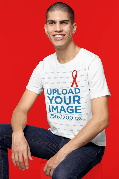World AIDS Day-Themed T-Shirt Mockup of a Man Sitting in a Studio