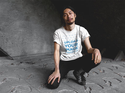 Asian Man with Beard Wearing a Round Neck Tee Template While Crouching