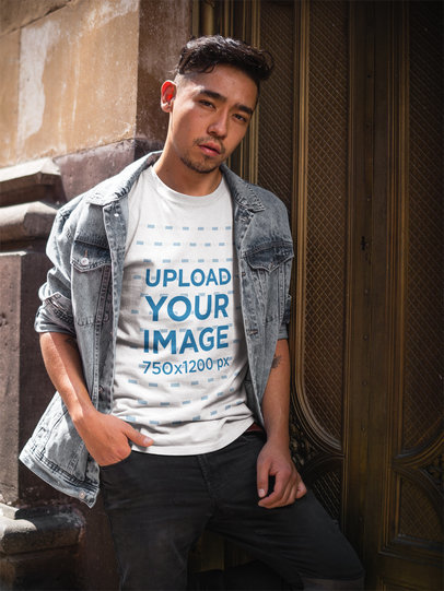 Asian Dude Wearing a T-Shirt Mockup While Against a Golden Door