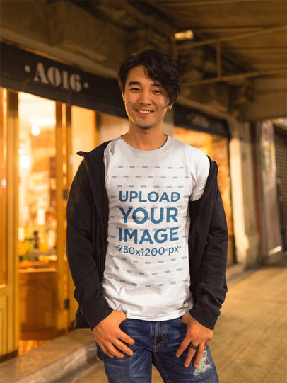 Happy Asian Man Wearing a Round Neck Tshirt Template While in the Street