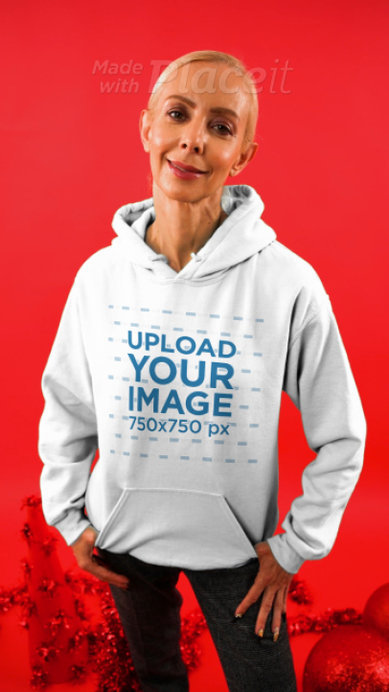 Christmas-Themed Video of a Happy Woman Wearing a Hoodie and Holding a Gift Bag