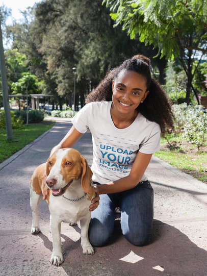 Woman with a Dog Wearing a T-Shirt Mockup at the Park