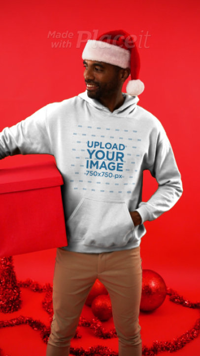 Hoodie Video Featuring a Man Holding a Xmas Present 