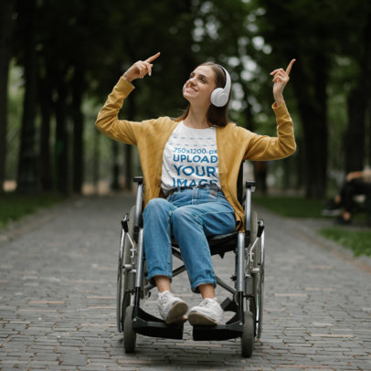 T-Shirt Mockup of a Happy Woman Listening to Music and Using a Wheelchair