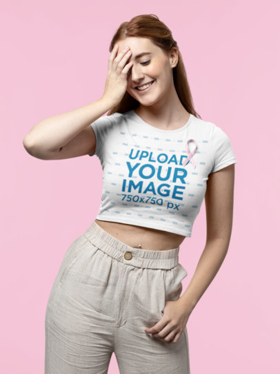 Cancer Awareness-Themed Mockup of a Young Woman Posing with a Crop Top