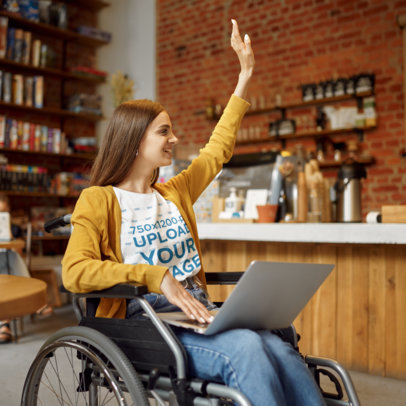 T-Shirt Mockup of a Woman Working at a Cafe and Using a Wheelchair