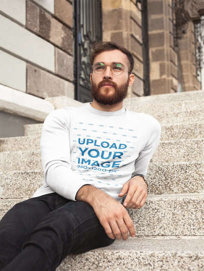 Man Wearing a Crew Neck Sweatshirt Template While Lying in the College Stairs a17727