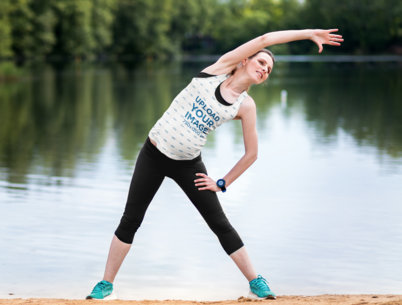 Tank Top Mockup Featuring a Pregnant Woman Exercising by a Lagoon