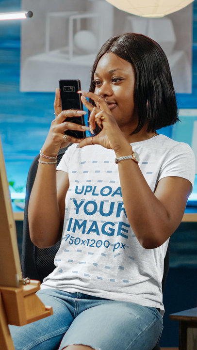 T-Shirt Mockup of a Young Woman Taking a Picture With Her Phone m17271-r-el2