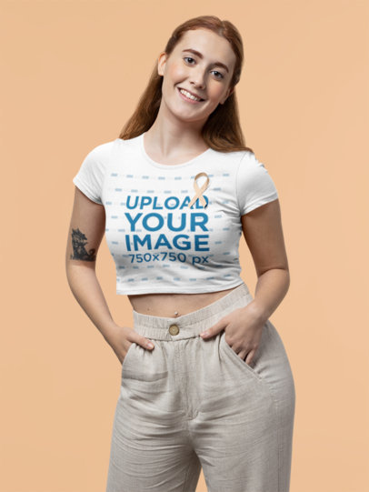 Crop Top Mockup of a Happy Woman Wearing a Ribbon for Cancer Awareness