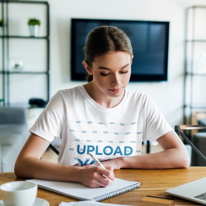 Basic Tee Mockup Featuring a Young Female Student Writing at Home m12280-r-el2
