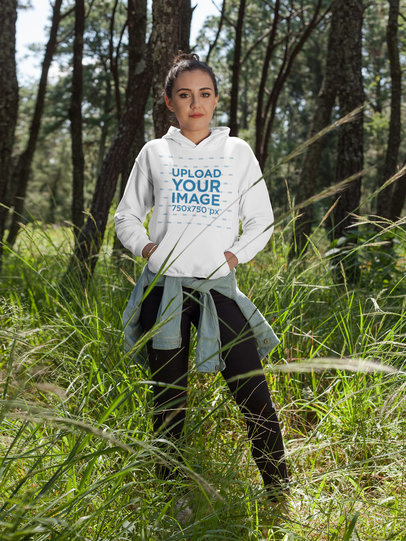 Girl Wearing a Pullover Hoodie Mockup While at a Forest a17677