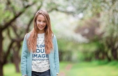 T-Shirt Mockup Featuring a Long-Haired Girl in Nature