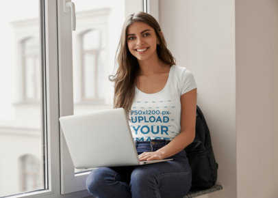 T-Shirt Mockup Featuring a Happy Woman Working on Her Computer