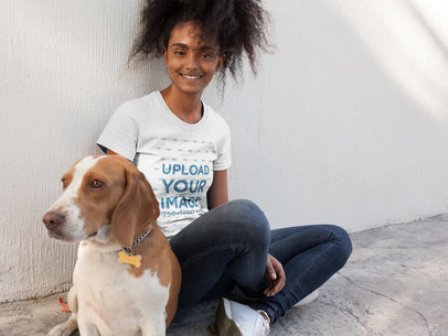 Mockup of a Woman Wearing a T-shirt  while Sitting with her Dog 