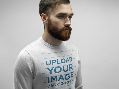 White Dude Wearing a Crewneck Sweatshirt Template While Standing Against a Solid Background