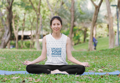 Sleeveless T-Shirt Mockup Featuring a Woman Doing Yoga at a Park