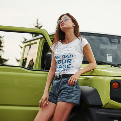 Round-Neck T-Shirt Mockup Featuring a Woman Posing Against a Car