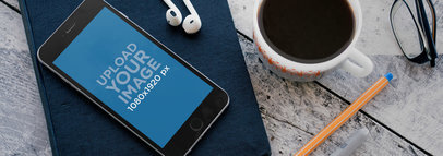 Wide Mockup of an iPhone 6 on a Book