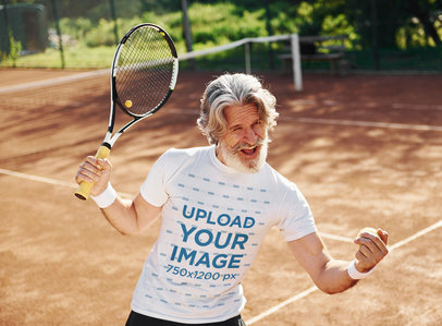 T-Shirt Mockup of a Happy Senior Man Playing Tennis