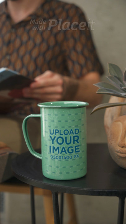 Video of a 15 oz Enamel Coffee Mug Featuring a Man Reading at Home
