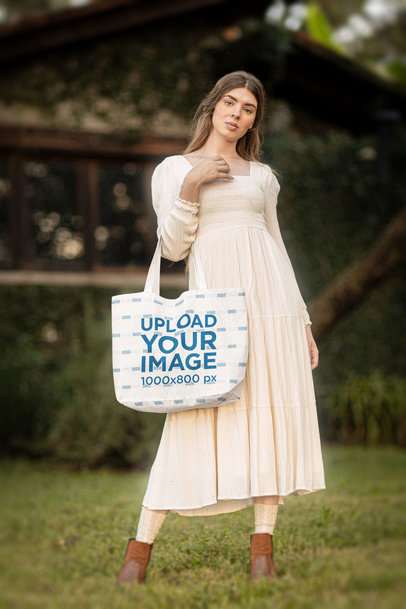 Tote Bag Mockup Featuring a Woman in a Cottagecore Styled Outfit m18729