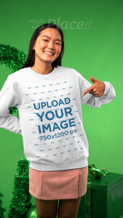 Christmas-Themed Video Featuring a Happy Woman Pointing at Her Sweatshirt 