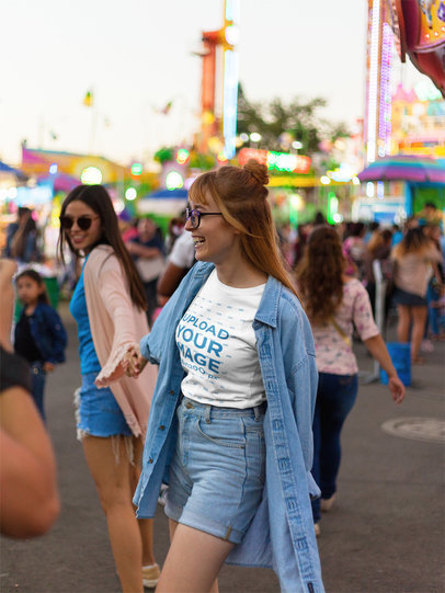 Happy Woman Wearing a Tshirt Template at an Amusement Park