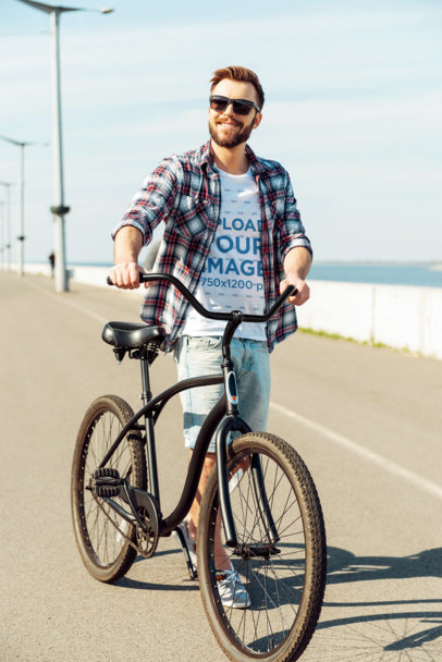 T-Shirt Mockup of a Man with Sunglasses Walking with His Bike m16618 r-el2