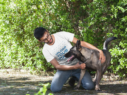 Man Wearing a Tshirt Mockup while Petting his Dog a17893