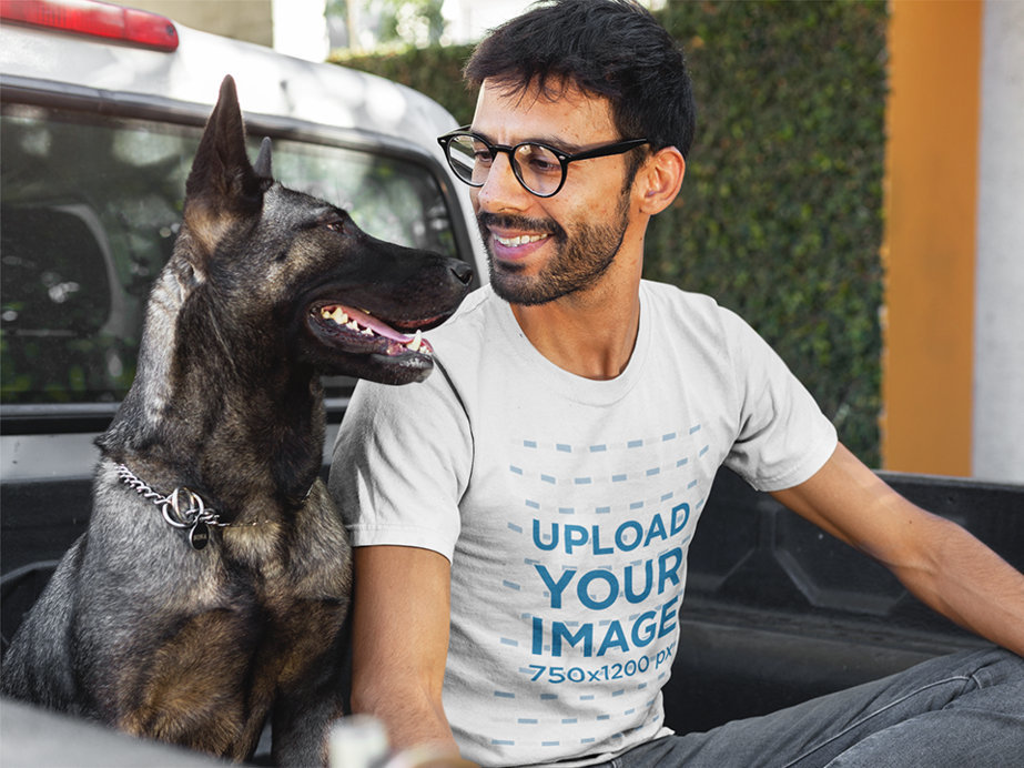 Man Smiling at his Dog Wearing a Tshirt Mockup on the Back of a Truck