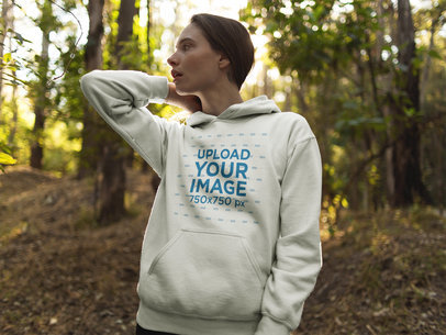 White Girl Wandering in the Woods Wearing a Pullover Hoodie Mockup a17904