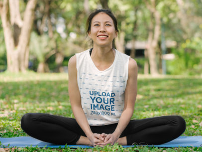 Sleeveless Tee Mockup of a Smiling Woman Doing Yoga at a Park