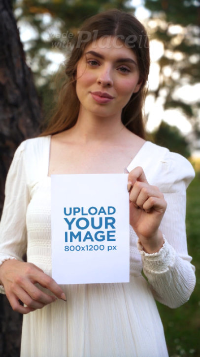 Video of a Woman with a Cottagecore-Aesthetic Outfit Holding a Flyer 4413v