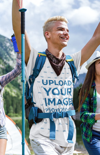 T-Shirt Mockup Featuring a Young Hiker Raising His Arms 