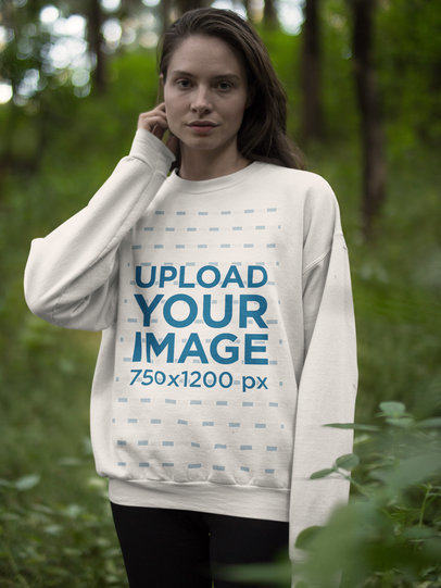 White Woman Wearing a Crew Neck Sweatshirt Template While in the Woods