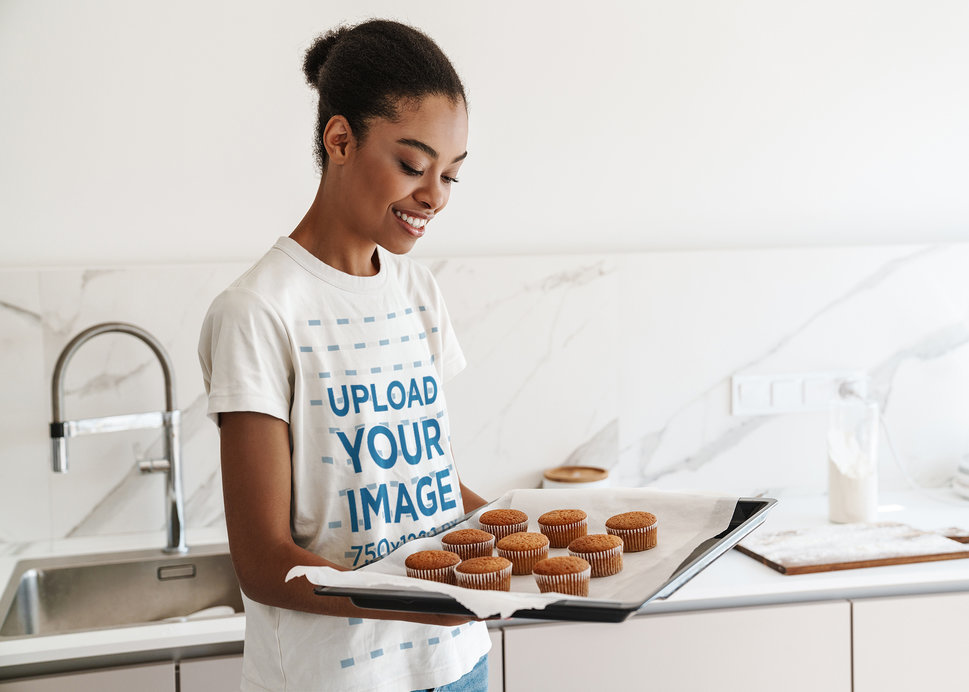 T-Shirt Mockup of a Young Woman Making Cupcakes