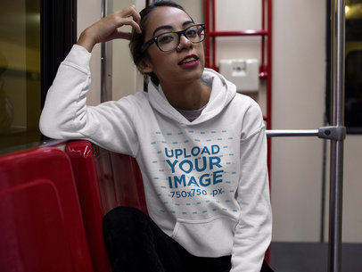 Happy Hispanic Girl Wearing a Pullover Hoodie Template While in the Metro a17650
