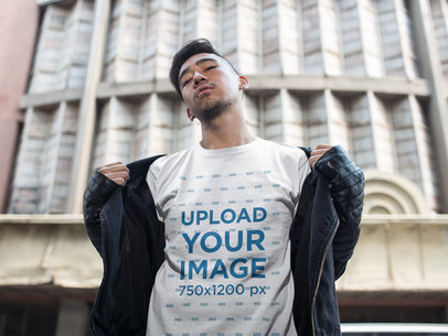 Cool Asian Guy Wearing a Tshirt Mockup Outside of a Theater