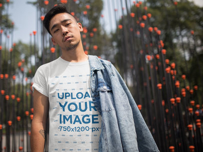 Cool Asian Dude Wearing a Tshirt Template While Near an Urban Art Structure