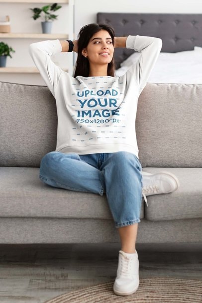 Sweatshirt Mockup Featuring a Happy Woman Relaxing at Home