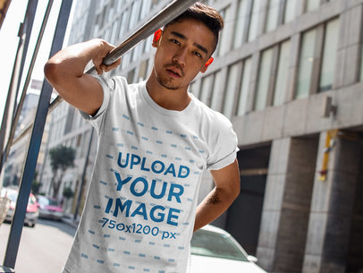 Dude Wearing a Round Neck Tee Template While in Front of a City Building