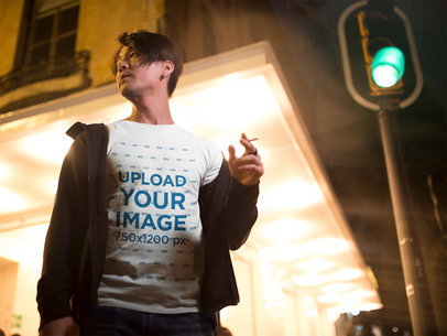 Handsome Man Wearing a T-Shirt Mockup while Crossing the Street