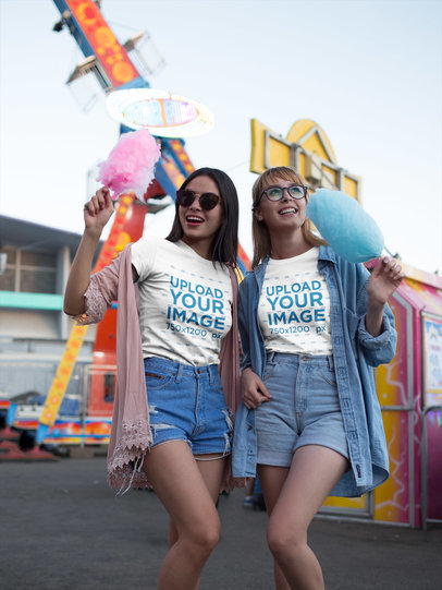 Friends Wearing T-Shirts Mockup While Eating Cotton Candy at a Carnival
