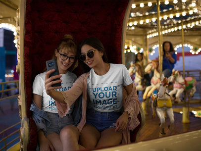 Girlfriends Wearing T-Shirts Mockup While in a Carousel