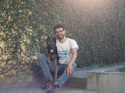 Man Wearing a Tshirt Mockup While Sitting with his Dog a17898