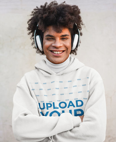 Hoodie Mockup Featuring a Curly-Haired Man Using Headphones