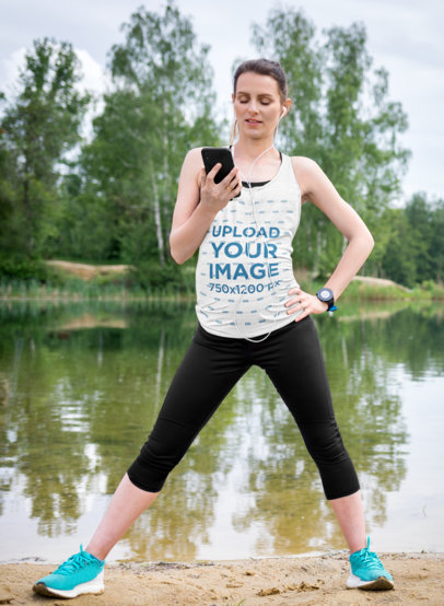 Tank Top Mockup of a Pregnant Woman wearing Activewear Clothes while Using her Phone
