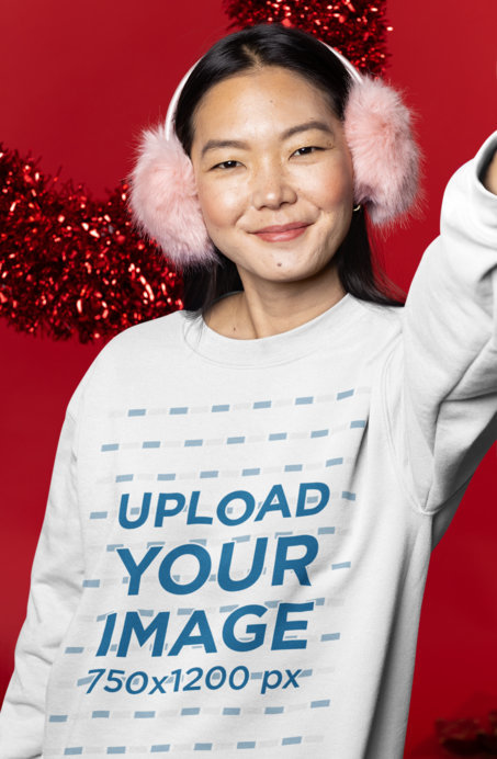 Christmas-Themed Mockup of a Woman in a Sweatshirt Taking a Selfie